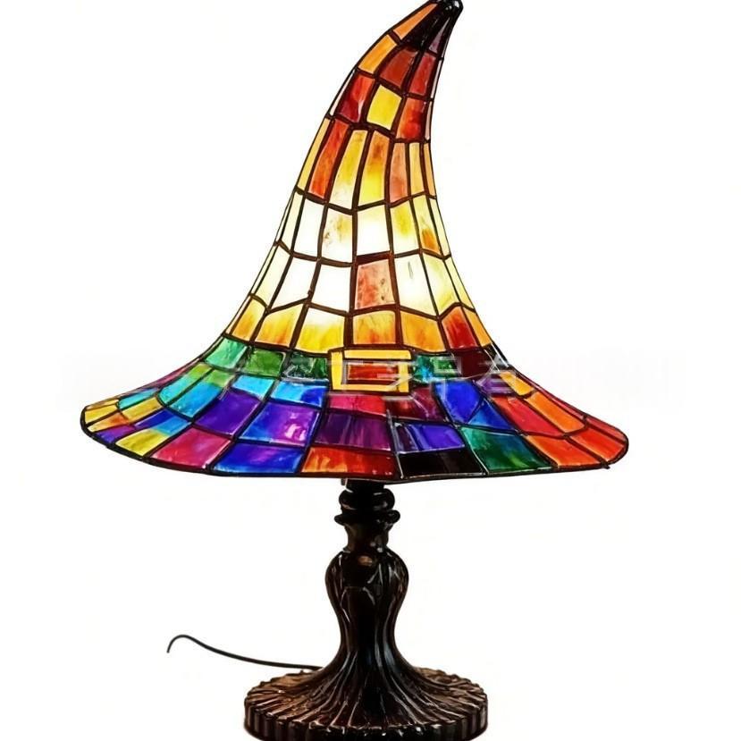 Witch Hat Table Lamp with a multicoloured brim and amber pointed shade