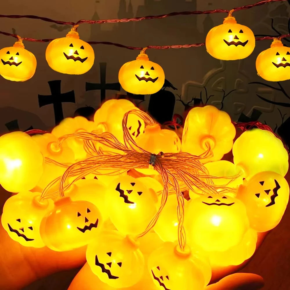 Jack-O-Glow pumpkin string lights glowing warm white, shown close up