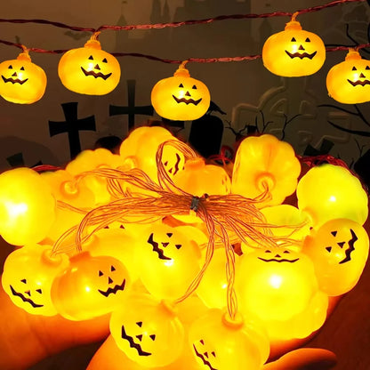 Jack-O-Glow pumpkin string lights glowing warm white, shown close up